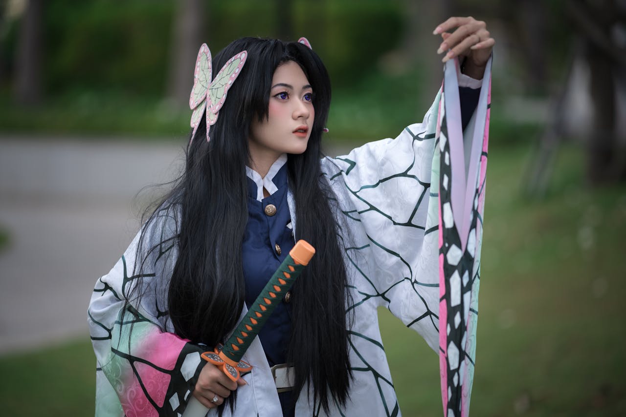A person cosplaying as a character with a samurai-style katana in an outdoor setting.